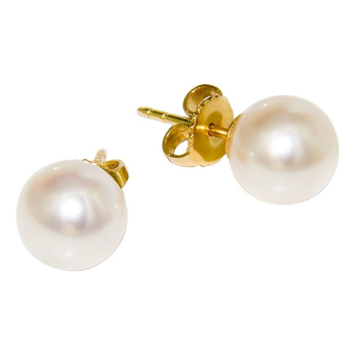 Tiffany & Company 8.5 M.M. Pearl Stud Earrings, fine white color with almost no surface blemishes. 18K Yellow gold Posts and backs.Original Tiffany box.