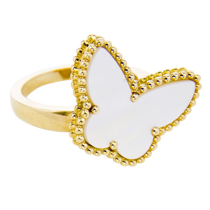 18K yellow gold and mother of pearl Butterfly ring by Van Cleef & Arpels.  Finger size = 6 1/2  Signed and Numbered.
