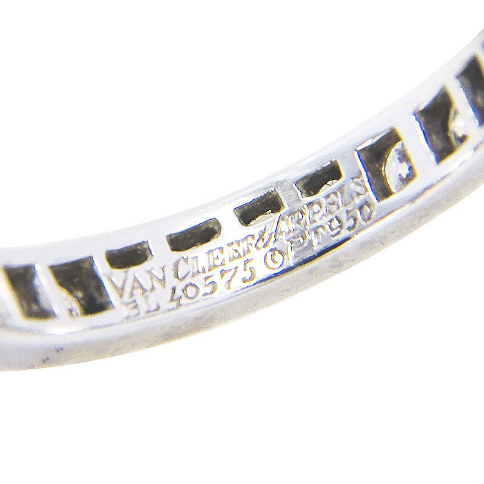 Platinum and Diamond Eternity Band Ring by Van Cleef & Arpels, set with 1.10 Carat of Fine White Brilliant cut Diamonds, Finger Size = 4 1/2.  Signed and Numbered.