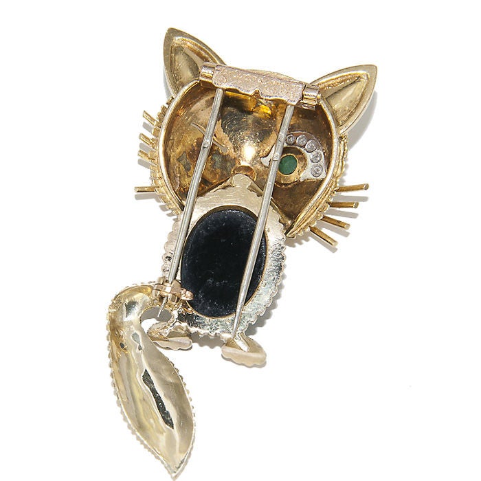 18K Yellow Gold Cat Brooch by Van Cleef & Arpels, Onyx Body, Emerald Eye,Diamond Eye Brow and Ruby Nose, finely textured and Detailed. Signed and Numbered.