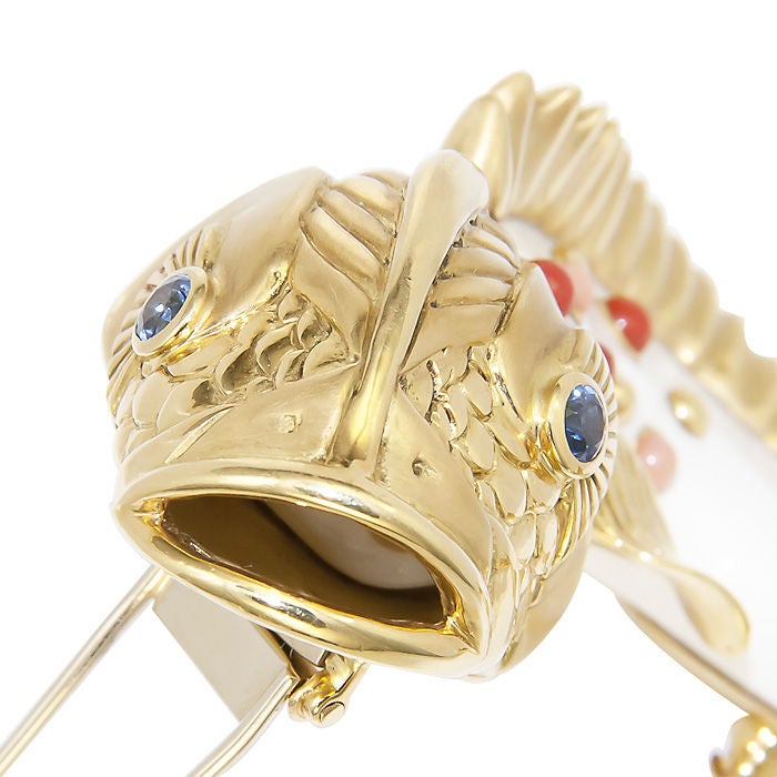 Incredible, Large White Coral, 18K Yellow Gold Fish Brooch by Seaman Schepps, very detailed, further set with Sapphires and Red Coral, signed and numbered.