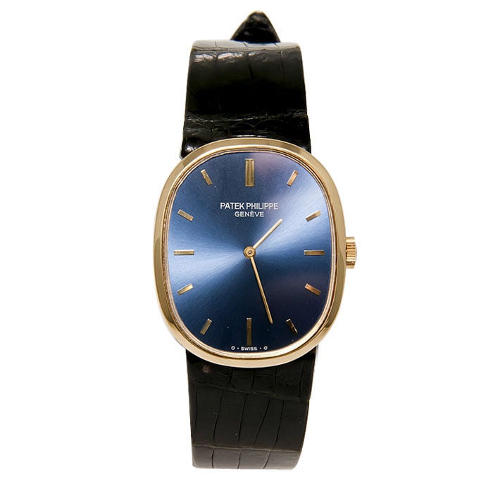 Gents 18K Yellow Gold Ref.3748 Ellipse Wrist Watch, Blue Dial with Raised yellow Markers, Manual Wind Movement, Original Black Strap and Patek Philippe Gold Buckle and Original Patek Philippe Box.