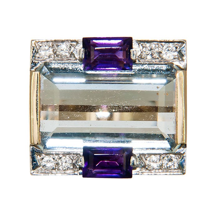 14K yellow Gold and Gem Set Ring by M & J Savitt, Thick and Bold Shank, top is centrally set with a step cut Aquamarine and further set with 2 step cut Amethyst and 8 small Round Brilliant cut Diamonds. Finger size = 5 1/2