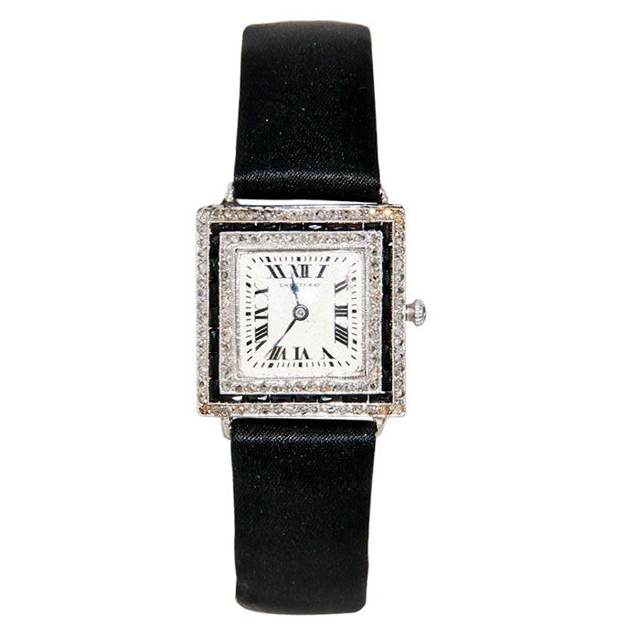 Lady's platinum, rose-cut diamond and onyx wristwatch retailed by Dreicer & Co. 17-jewel manual-wind movement by Haas, new satin strap. 

Dreicer was an american company who rivaled the finest jewelry firms of Europe and was purchased by Cartier
