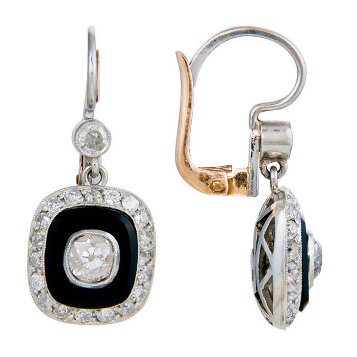 Elegant Dangle Earrings, Platinum with Old Mine Cut Diamonds that are bezel set in cushion shape Beveled Onyx and Further surrounded by Old Mine cut Diamonds. Total Diamond weight 2 Carats.