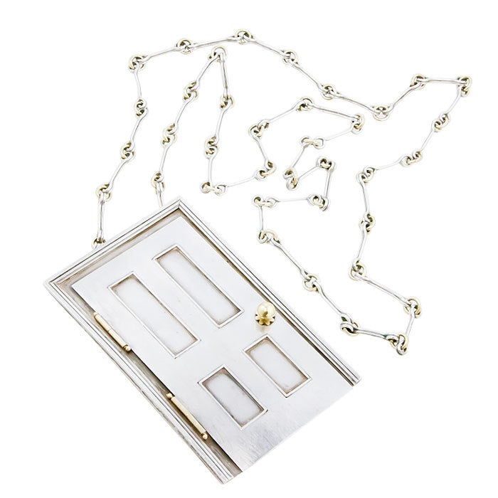 Very Whimsical Sterling Silver and Gold Door Necklace by barbara Cartilage, incredible 3 dimentional detail in and out.The door measures 3 1/8  X  2 Inch.