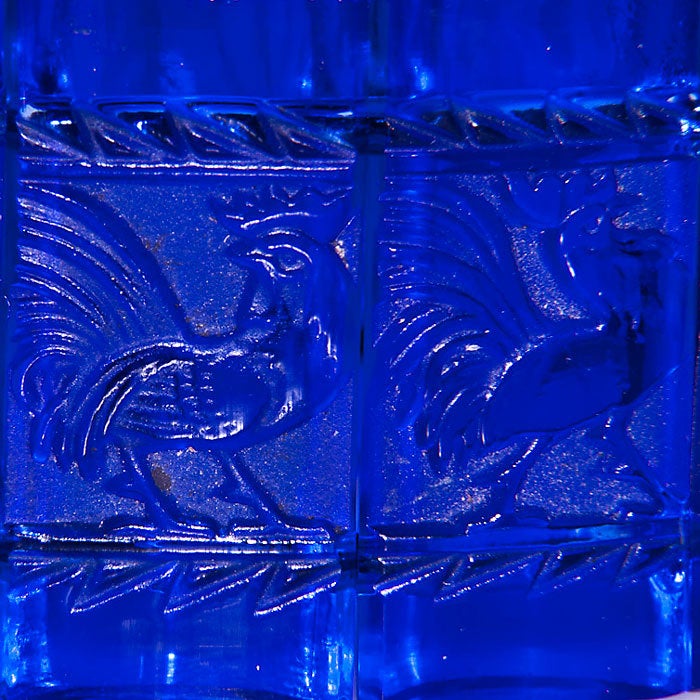 Rare, Blue Cobalt Glass Panel Bracelet by Rene Lalique. Each of the 11 Panels measures 1 1/4 X 5/8 Inch and Features a High releif Rooster in a different Pose. This bracelet has been Reecently restrung with Black elastic as original and still has
