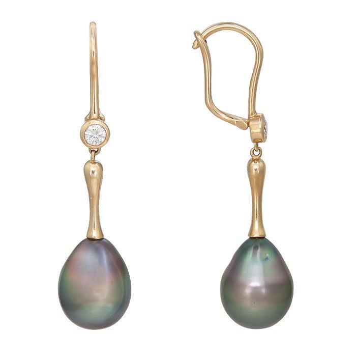 Very Elegant drop Earrings by Elsa Peretti for Tiffany & Company. 18K yellow Gold and set with Round brilliant cut Diamonds totaling .40 carat. and Tahitian Grey Pearls measuring 11.5 M.M.