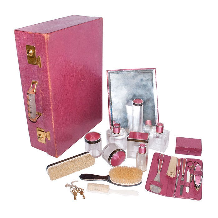 Sterling Silver and Enamel fitted Vanity Travel case. Complete with all pieces, Etched Crystal Bottles with Enameled Sterling tops, Mirror, Brushes, manicure pieces, Jewelry Box. Burgundy Leather case with Original Wool outer Protective cover.