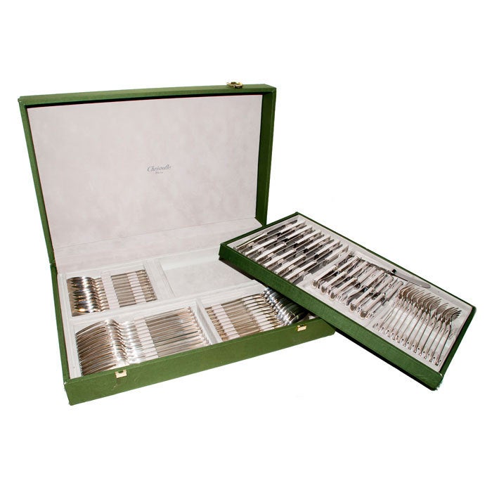 Service for 12,73 pieces total, Solid Sterling Silver Flatware set by Christofle in the Commodore pattern, original Fabric covered Wood, presentation Case. Each Piece is Stamped and hallmarked. Forks Measure 7 3/4 Inch and 6 3/4 Inch, spoons measure