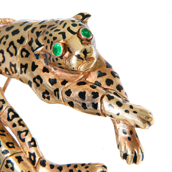 18K yellow Gold, Enamel and Diamond set Leopard Brooch by david Webb. Excellent Detail with every piece being articualted for realistic movement. Emerald Eyes and approximately 1.25 Carat of Diamonds.