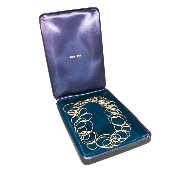 Paloma Picasso for Tiffany & Company Hammered Circles Necklace in 18K Yellow Gold. All Hand made, hand Hammered, can be worn as Long single necklace or Doubled. In Original presentation Case. 47 inch length, $7500.00 original retail Price.