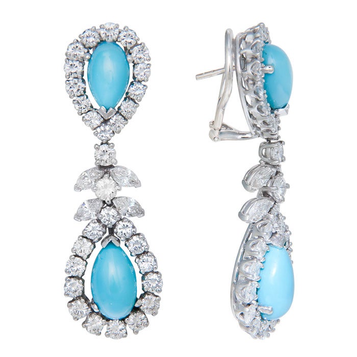 Circa: 1960s Platinum Ear Clips, set with 5 Carats of Round and Marquise Brilliant Cut Diamonds of very Fine Color and Clarity. Further set with Pear shape Turquoise. Posts with Omega Clips.