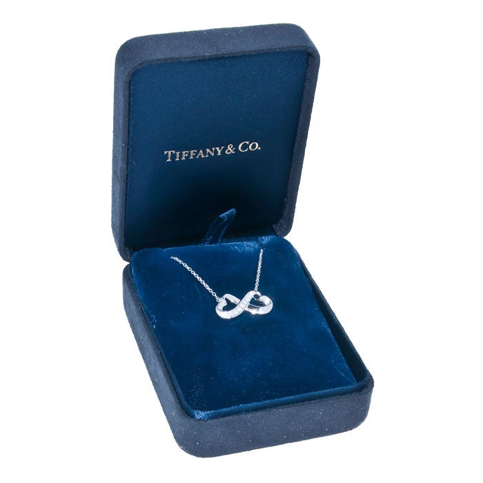 18K White Gold and Diamond set Pendant from the Double Hearts Collection by Paloma Picasso for Tiffany & Company. Suspended from a 16 inch Chain and comes in the Original box.