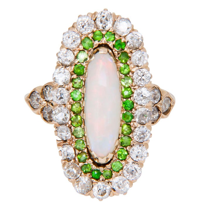Victorian 14K Yellow Gold ring Centrally set with Fire Opal, surrounded by Demantoid Garnets and Further Surrounded by old Mine Cut Diamonds.  Finger Size = 4 3/4