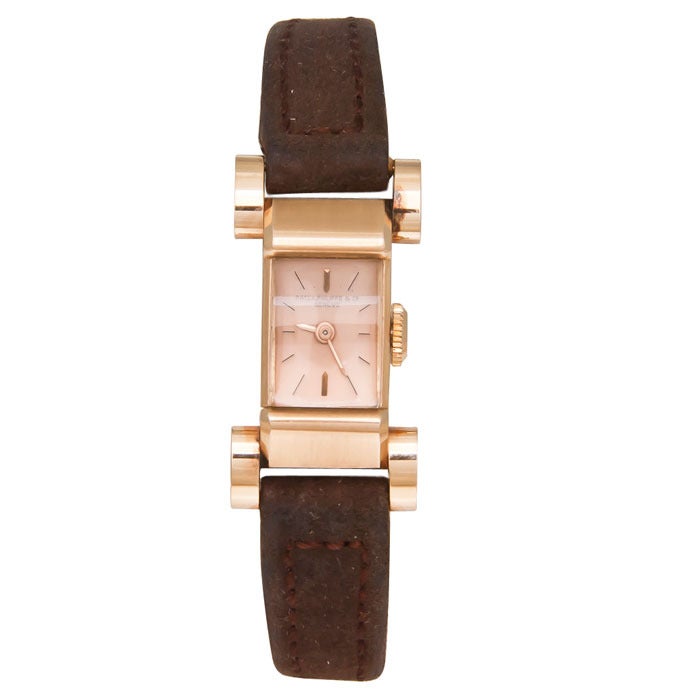 Patek Philippe rare lady's 18k rose gold wristwatch with unusual case, circa 1940s, with original rose gold buckle and original Patek Philippe box. Original dial with rose gold hands. 

Comes with Patek Philippe Extract from the Archives.