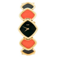 Piaget Lady's Yellow Gold, Coral and Onyx Bracelet Watch circa 1980