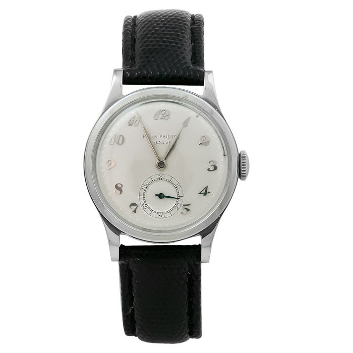 Patek Philippe stainless steel Calatrava wristwatch, circa 1940s,  30 mm, waterproof case with screw back. Manual-wind movement, subsidiary seconds, silvered dial with raised white gold Breguet numerals and white gold hands, new black lizard strap.