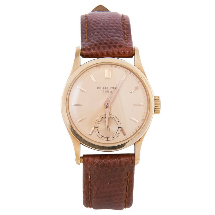 Patek Philippe 18k rose gold Calatrava wristwatch, circa 1940s, three-piece snap-back case, 30 mm, manual-wind movement, subsidiary seconds, raised rose gold baton indexes and rose gold hands. New brown lizard strap. 

With Patek Philippe Extract