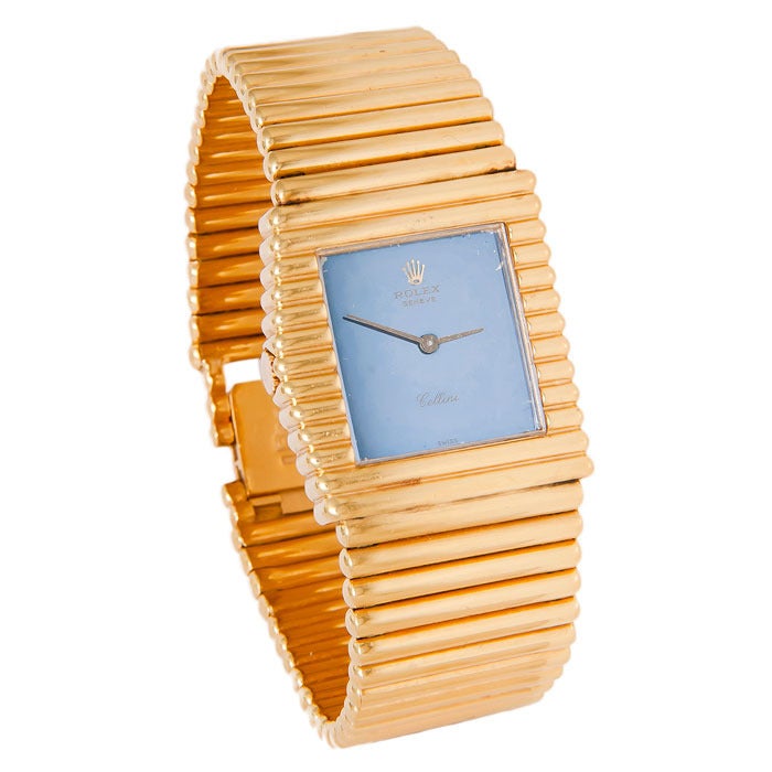 18k yellow gold Rolex King Midas bracelet watch, circa 1980s. Flexible link bracelet, manual-wind movement. Blue dial with gold hands.