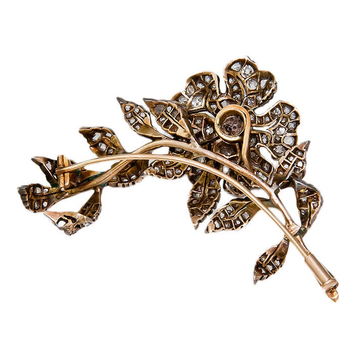 Circa: 1890s Silver topped and Gold Backed En Tremblant Flower Brooch Set with approximately 2 Carats old Mine Cut Diamonds.