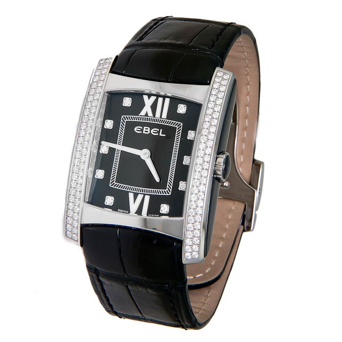Ebel Brasilia, large stainless steel and diamond-set wristwatch. Never worn, set with two rows of fine white diamonds on either side of the dial. Diamond weight totals 2 carats. Quartz movement, black dial with diamond indexes. Black leather strap