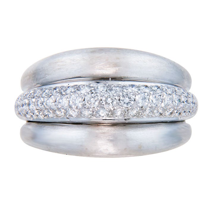 Circa: 1990s 18K White gold and Diamond Pave Dome style ring By Damiani , set with 1.50 carats fine white Diamonds. Light brush finish on the sides. Finger size = 7 1/2