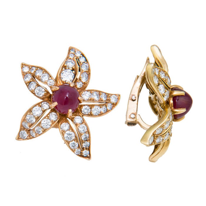 Circa: 1980s 18K yellow Gold, Diamond and Ruby Ear Clips, extremely well made and set with Fine Round Brilliant cut Diamonds totaling 2.25 Carats that are G in Color and VS in Clarity, centrally set with cabochon Rubies that are approximately 1.50