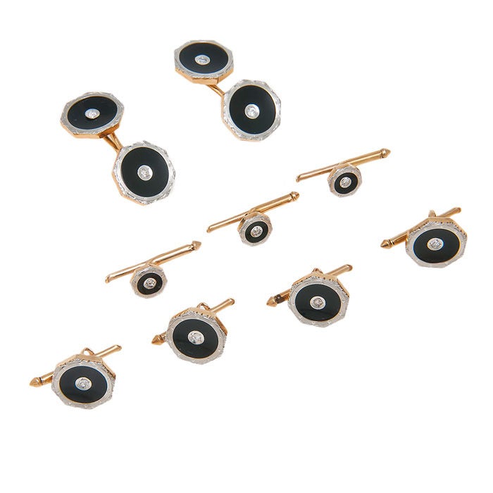 Circa: 1920s  Gents Tuxedo dress set, 14K Yellow gold with White Gold tops, Onyx and Diamonds. The set comprises cufflinks, shirt studs and vest studs. In the original box from Marshall Field & Company, and in exceptional mint condition.