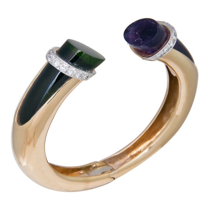 Circa: 1990 18K yellow Gold Hinged Cuff Bracelet set with Diamonds, Amethyst and Green Tourmaline. Diamonds totaling .90 Carat, a good average size bracelet that will fit most any wrist.