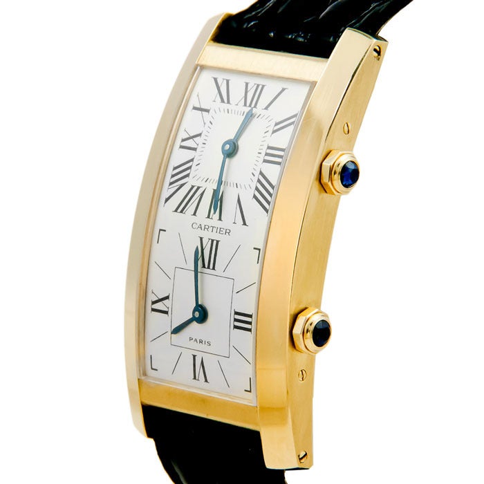 Cartier 18k yellow gold dual time zone wristwatch, Tank Cintree. Two manual-wind movements, silvered dial, sapphire crowns, new cartier black croco strap and gold plated Cartier buckle.