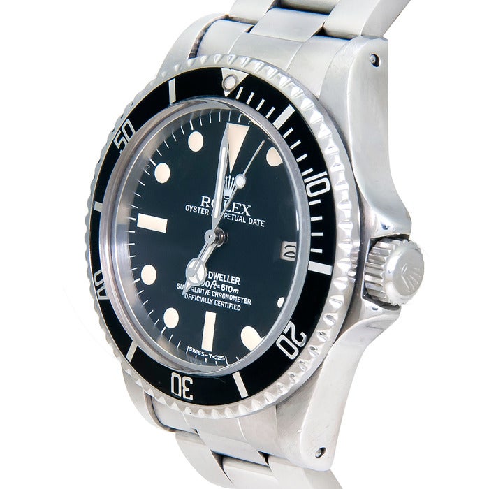 Rolex stainless steel Sea-Dweller wristwatch, Ref. 1665, serial number 5 million, circa 1978. Black dial with luminous markers, date at 3 o'clock, original hands and an excellent original bezel insert. This is a one-owner watch from the original