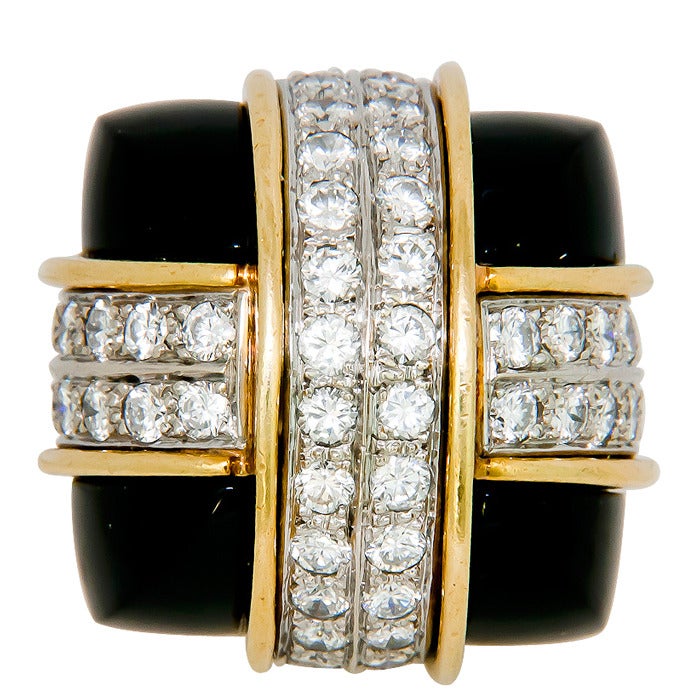 Circa: 1960s 18K yellow and white Gold Dome Ring by La Triomph, Set with 3.50 Carats of fine White Diamonds and Buff Cut Onyx at each corner of the ring. An extremely well made and assembled Ring.