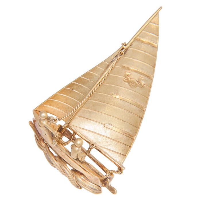 Circa:  1970s 18K Yellow Gold Racing Sail Boat Brooch, with moveable Sail. very nicely detailed and having french hall marks.