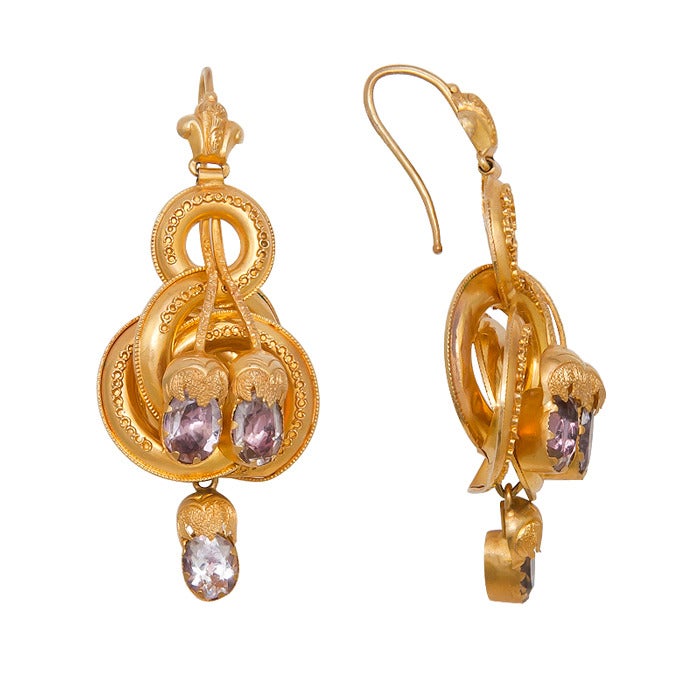 Circa: 1850s 15K yellow Gold Earrings with fine granulation work and set with Foil Back stones having a light purple color.