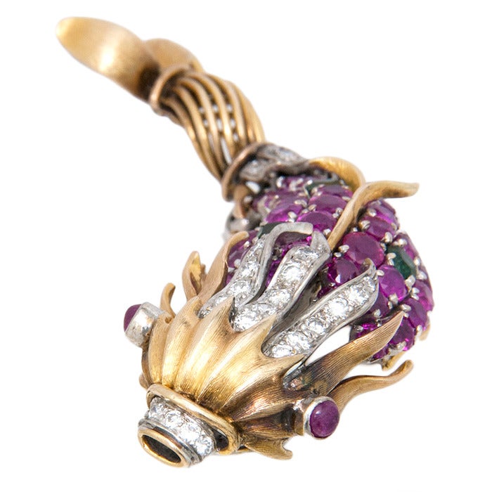 Circa: 1960s 14K Yellow and White Gold Fish Brooch, in the style of Schlumberger, very whimsical and nicely detailed, set with Diamonds, Rubies and tourmalines. Signed H.K.