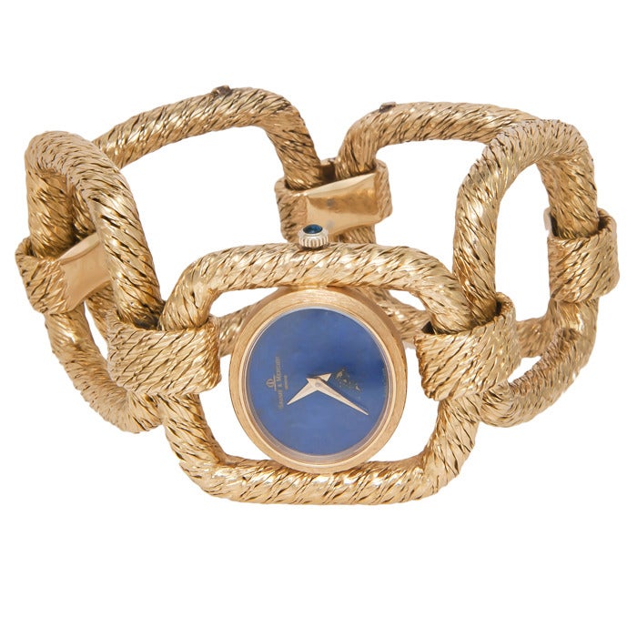 Baume & Mercier 18k yellow gold lady's bracelet watch, retailed by Tiffany & Co, circa 1960s. Heavy yellow gold textured links, manual-wind movement, lapis lazuli dial.