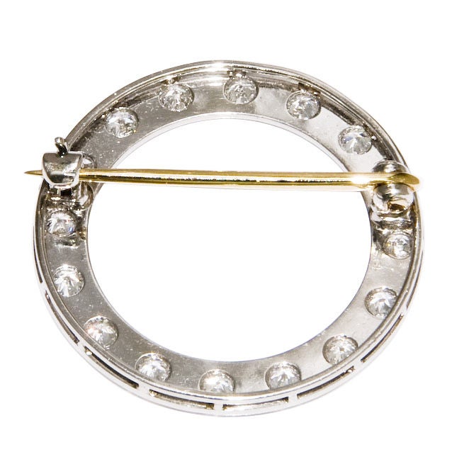 Circa 1920s signed Tiffany & Company, Platinum and Diamond Circle pin in original Tiffany Velvet Box. Diamond weight equals 1 Carat.