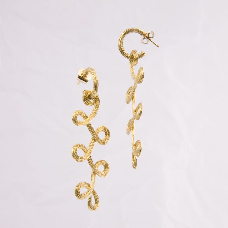 Beautifully crafted H. Stern Celtic Dunes earrings made of their signature 18k Noble gold with a textured, swirled design.
