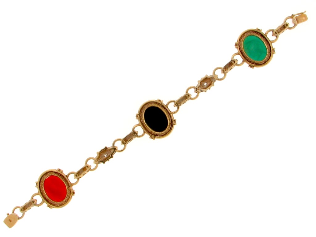 14 carat glass cameo bracelet - dark coral, black, and green.