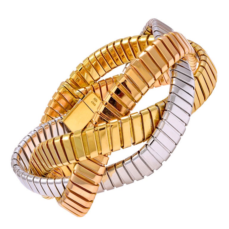 Yellow white and pink gold tripple row bracelet. For Sale