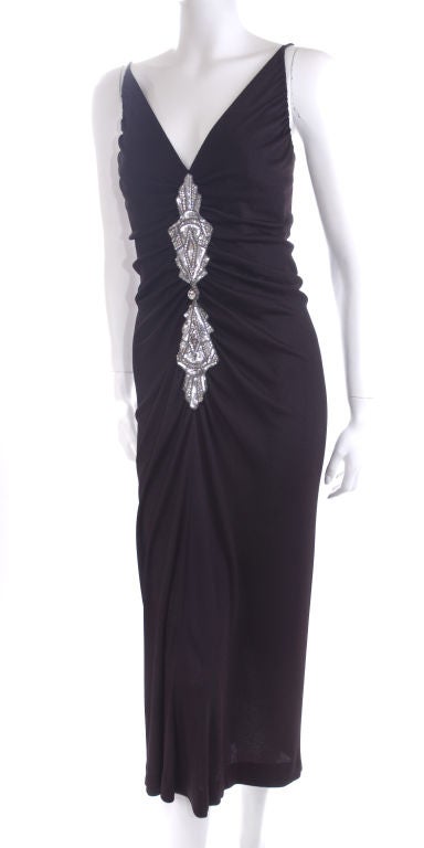 Crèation G. Kazazian - Paris! 1950s.<br />
Beautiful black silk jersey dress with an art deco inspired sequin and rhinestone embroidery.<br />
<br />
Measurements:<br />
Length 48” – bust 44 – waist 42-44”- hips up to 54” inches.<br />
<br