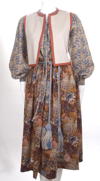 1976 Yves Saint Laurent Russian Collection Ensemble.<br />
Skirt,blouse,vest and belt.<br />
Size EU 36<br />
<br />
Measurements:<br />
Skirt length 30.5