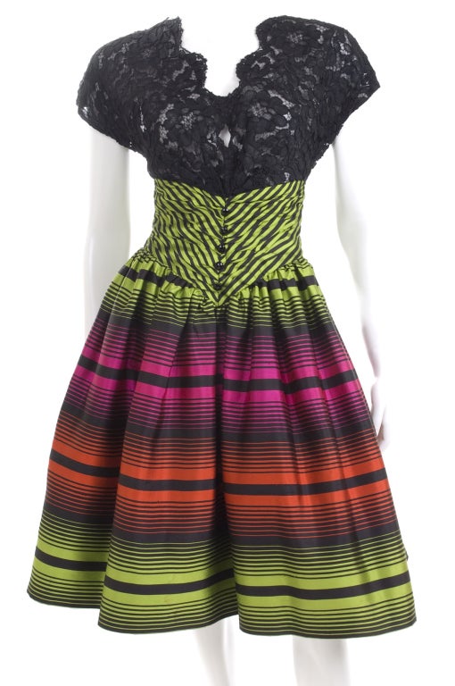 Ted Lapidus Boutique Couture Cocktail Dress.
Black lace and striped silk in beautiful colors.
Skirt with tulle lining.
Size 44 EU = 6/8 US
Excellent condition.
Measurements:
Length 41 - bust  36 - waist 26 inches