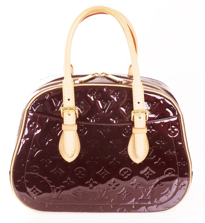 - SOLD -
2007 LOUIS VUITTON Monogram Vernis Summit Drive Amarante Handbag.
Gold hardware, two pockets outside and two inside.
Lining is brown.
Measurements:
13” length x 6” width x 10” heigh
Handle/Strap Drop: 6.5” inches

Date/Authenticity