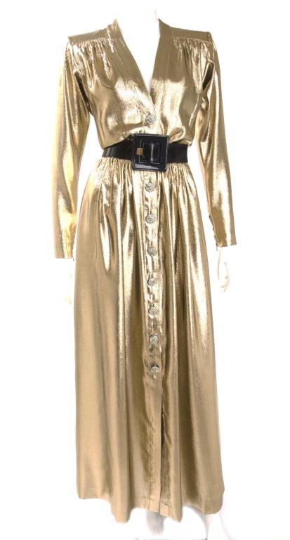 Yves Saint Laurent Gold Lame Evening Dress with Rhinestone Buttons
Black patent leather belt.
Pockets in the side seam.
Size 40 EU - 8 US

Measurements:
Length 59