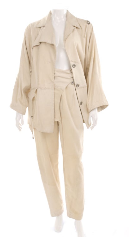 80's Issey Miyake Moleskin Suit in off white.
The belt is removable.
Very soft material feels and looks like a suede leather.

Measurements:
Jacket length 31