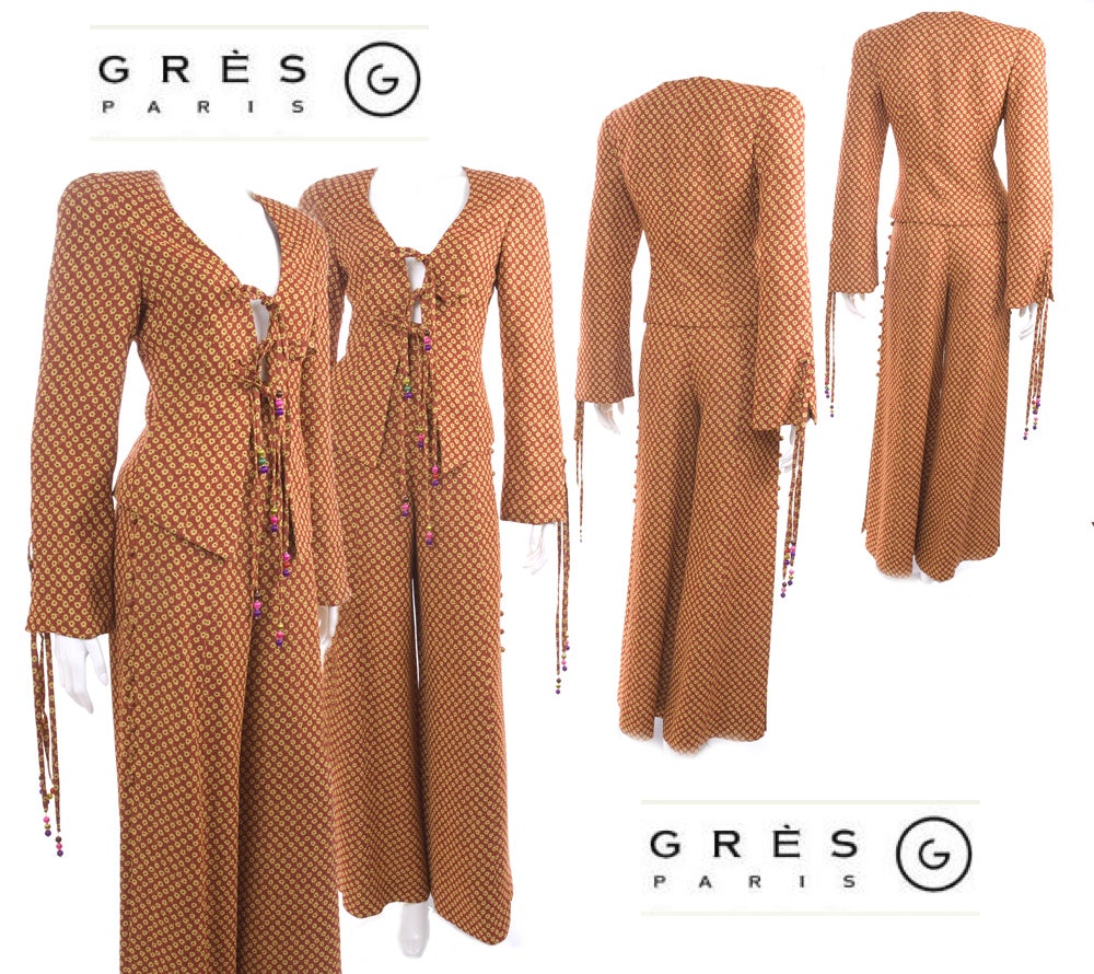 Vintage Madame Gres pant suit with wide legs and high slits and small buttons, jacket with string closure and beads. The color is a rich amber with yellow small flowers.
Excellent condition - no flaws to mention
Size: 38 EU - 6