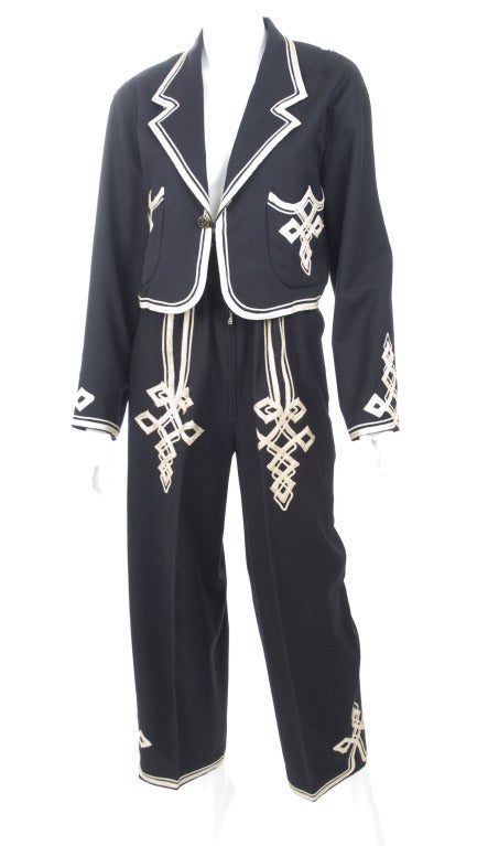 Matsuda Maroccan Inspired Embroidered Suit.
From his 1989 Collection which was inspired by Morocco.
Black wool with off white embroidery.
Size M

Measurements:
Jacket length 17.5 - bust 42