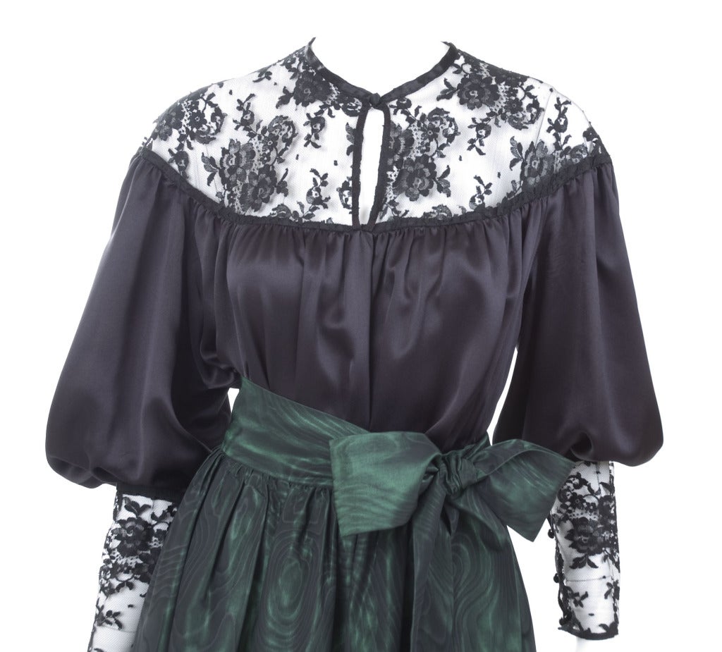 Yves Saint Laurent Black Satin Blouse and Green Moiré Skirt.
Amazing ensemble from the late 70's
Skirt has pockets in the side seams.
Size EU skirt 40 - US 6-8 

Measurements:
Blouse length 28